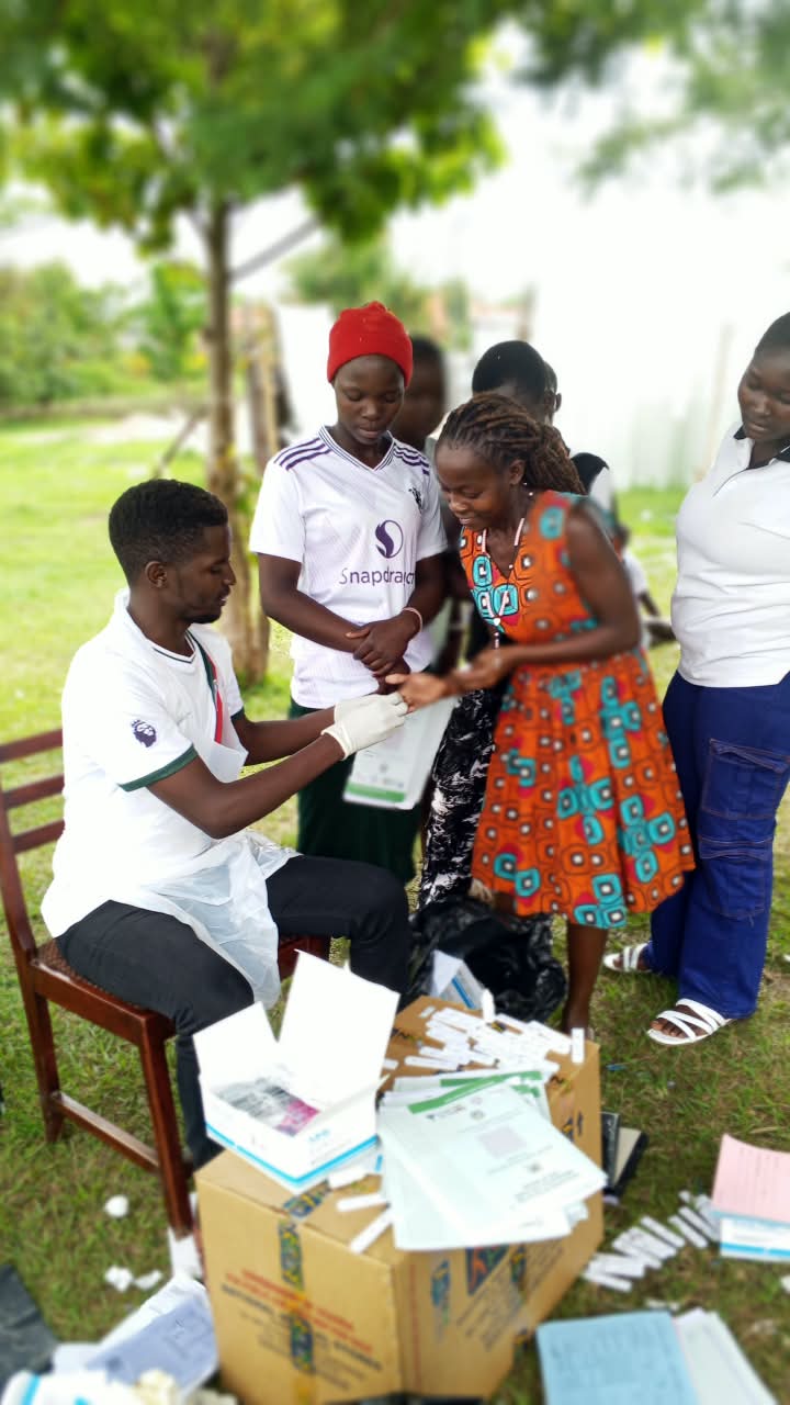 Health worker conducting testing at a community outreach session