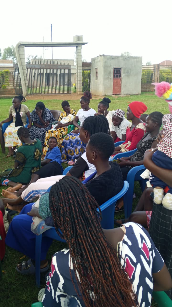 Young mothers seated at a community health session