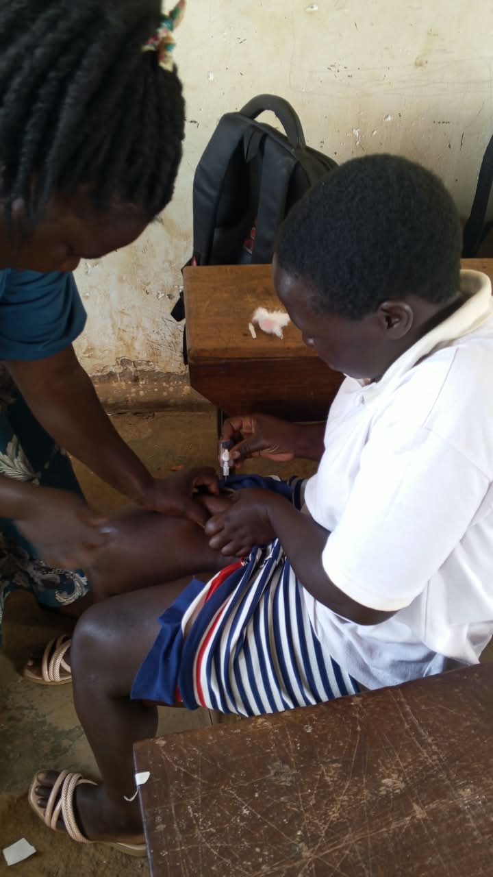 Health worker conducting finger prick HIV test