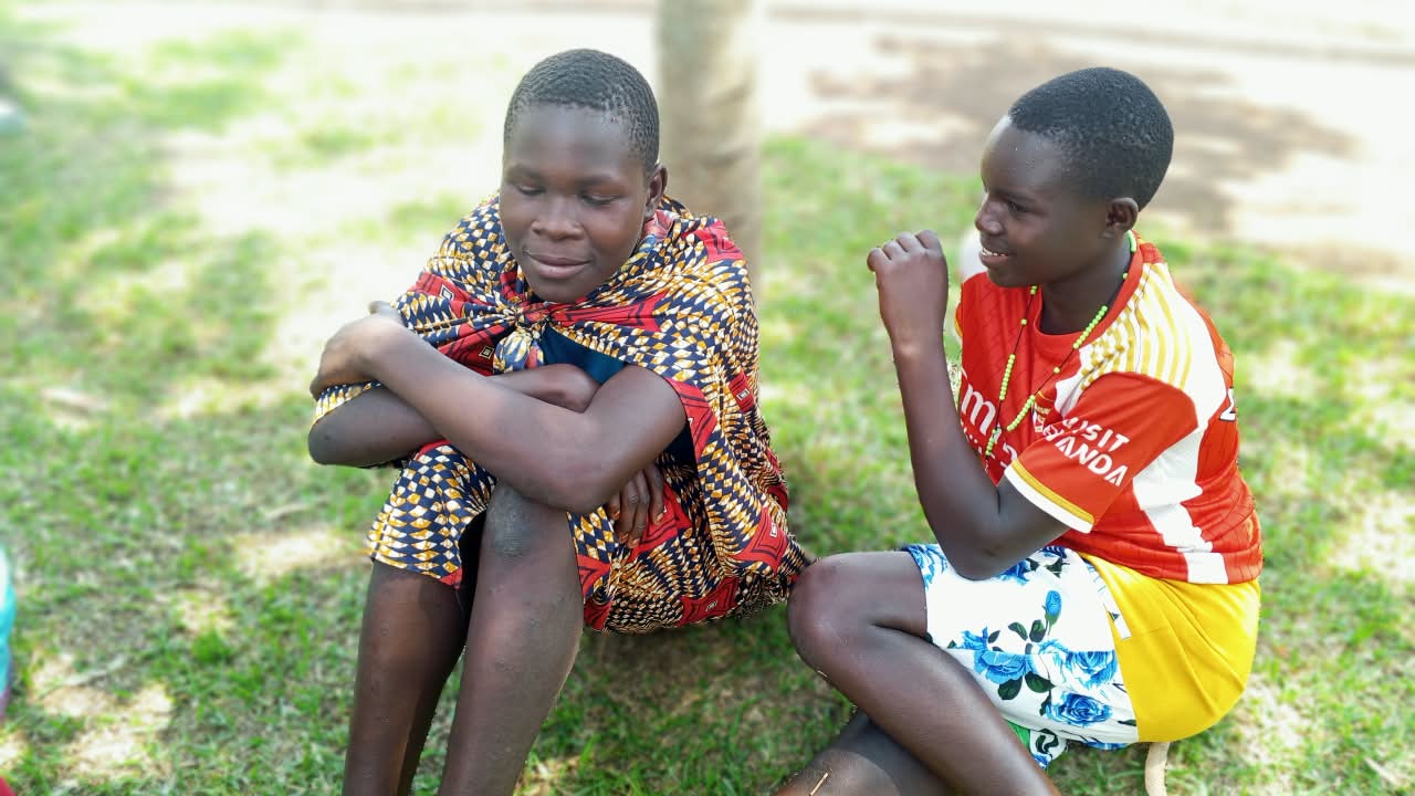 Two young people in conversation during a community session