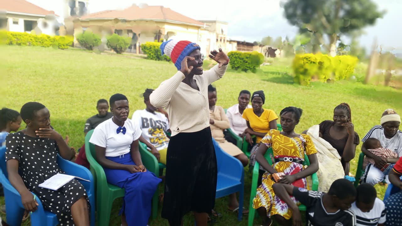 Community facilitator leading a health session for young parents in Tororo District, Uganda