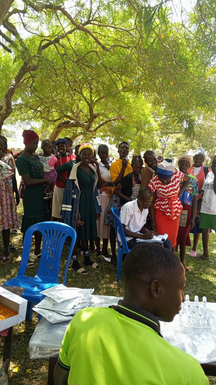 Crowd of community members at outdoor health outreach